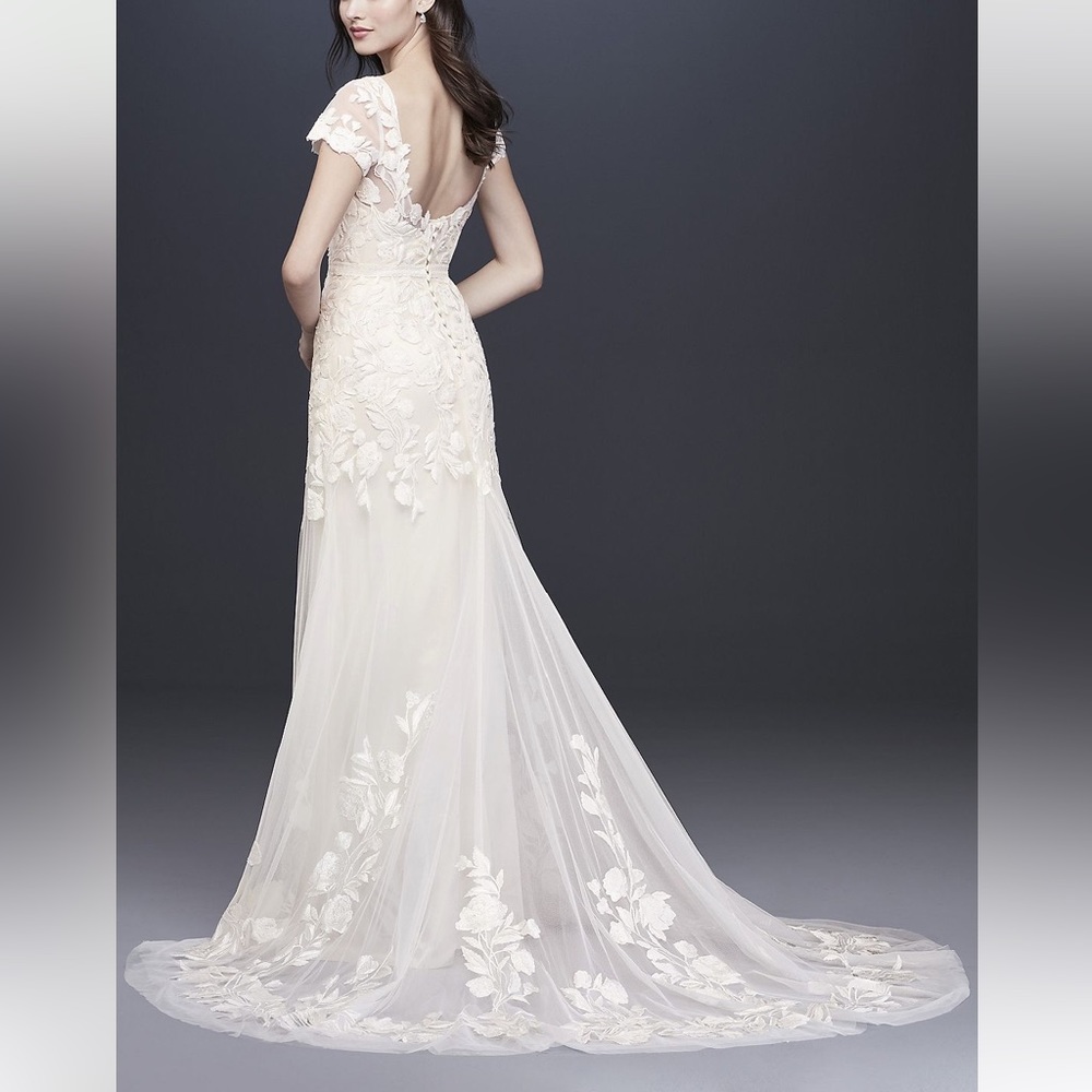 Brand new wedding dress size 14 unaltered with tags